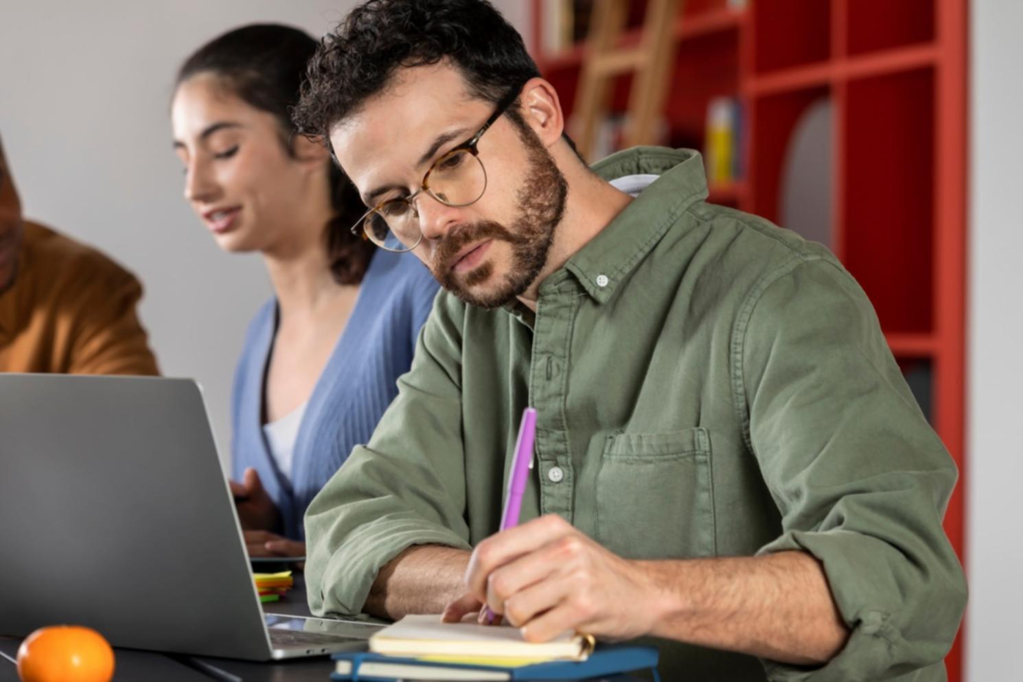 Instructor reviewing budget documentation with student